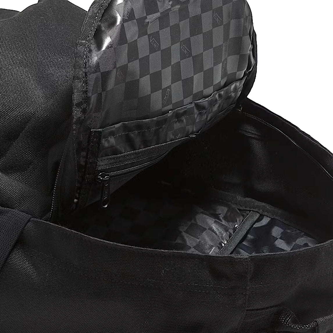 Interior view of the black Vans Startle Backpack showing organized compartments, laptop sleeve, and internal pockets for clean off-duty carry and daily essentials