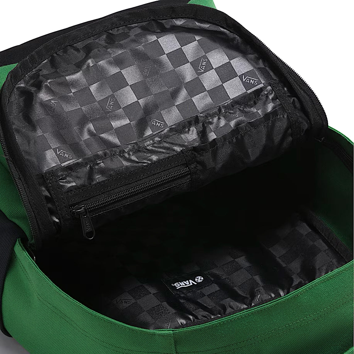 Interior of the Vans Startle Backpack in Pine Forest Green showing laptop sleeve and organization pockets for structured off-duty carry and daily essentials
