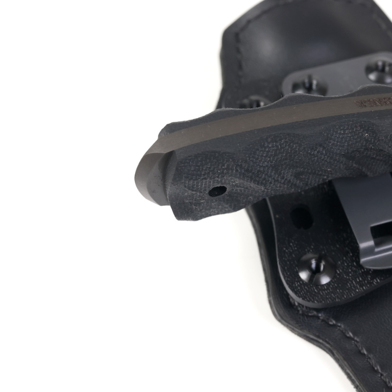 Close up of sculpted black laminate handle scales on Winkler Blue Ridge Crusher fixed blade knife highlighting ergonomic contouring and hardware. Available at Tactical Distributors.