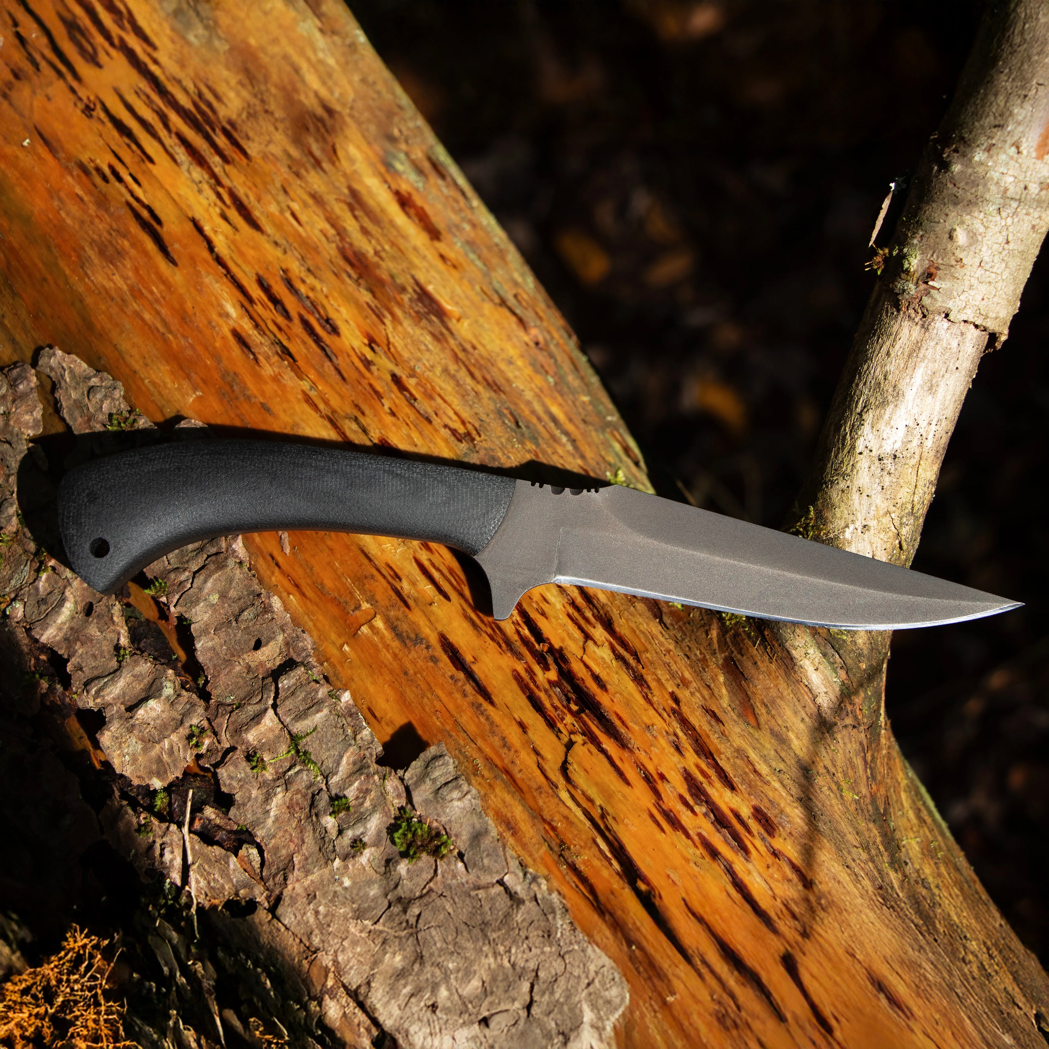 Winkler Knives Shadow Strike with black laminate plain handle worn on belt in tactical EDC setup showing discreet fixed blade carry for professional use