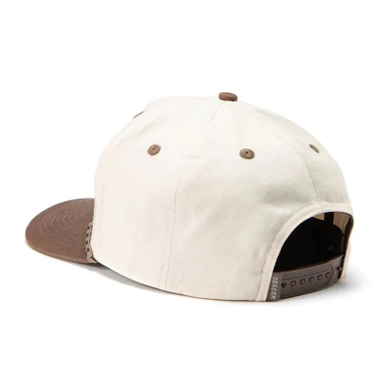 Beige cap with brown accents on a white background