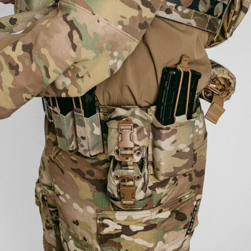 Operator wearing full tactical loadout with Frag Bag™ pouch mounted on Multicam belt rig in live deployment stance