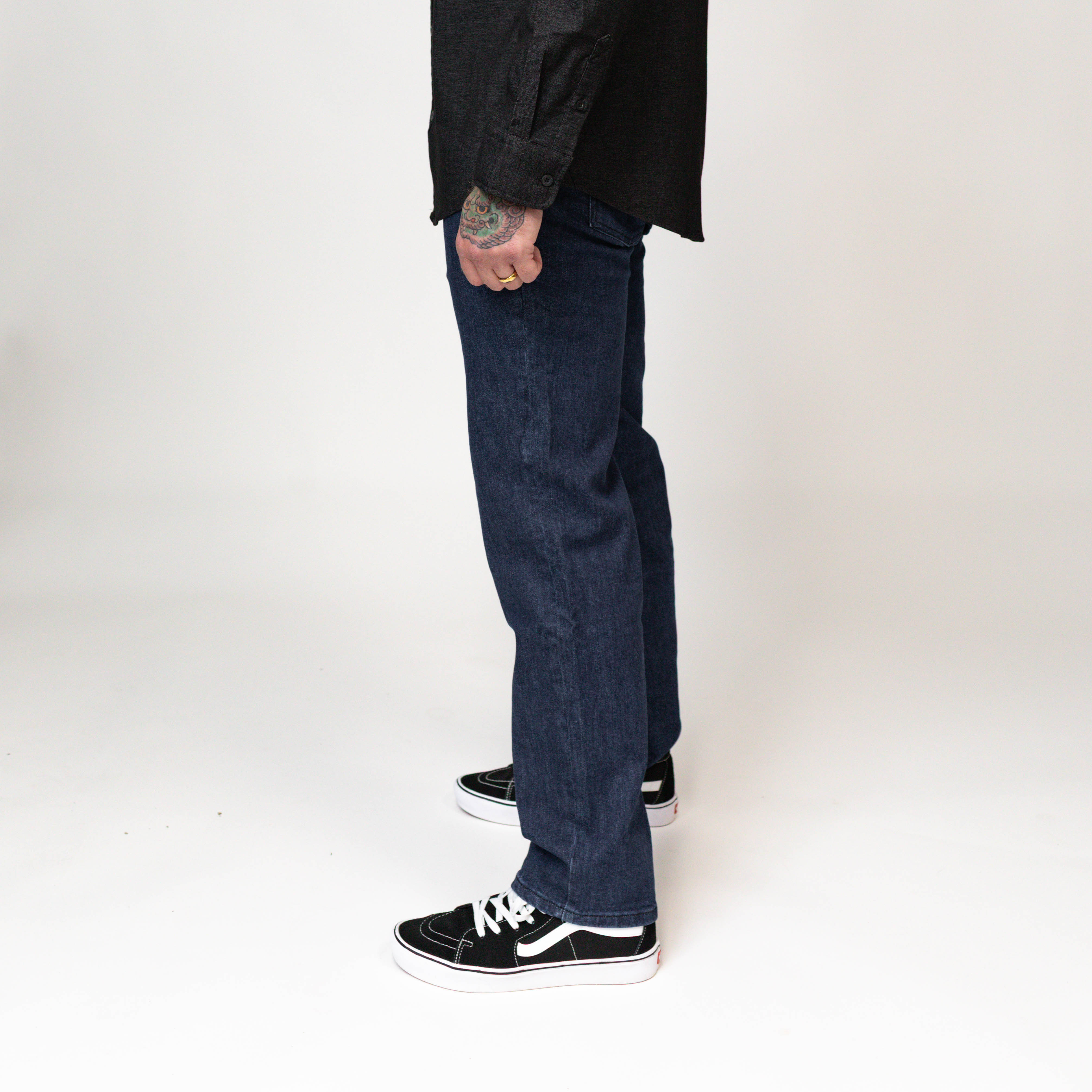 On body view of the TD McQuade Tactical Jeans in the Midnight wash showing the stretch tactical denim fit, concealed carry friendly waistband, discreet EDC pocket access, and reinforced construction for users searching for the best tactical jeans, CCW jeans, and everyday carry tactical denim.