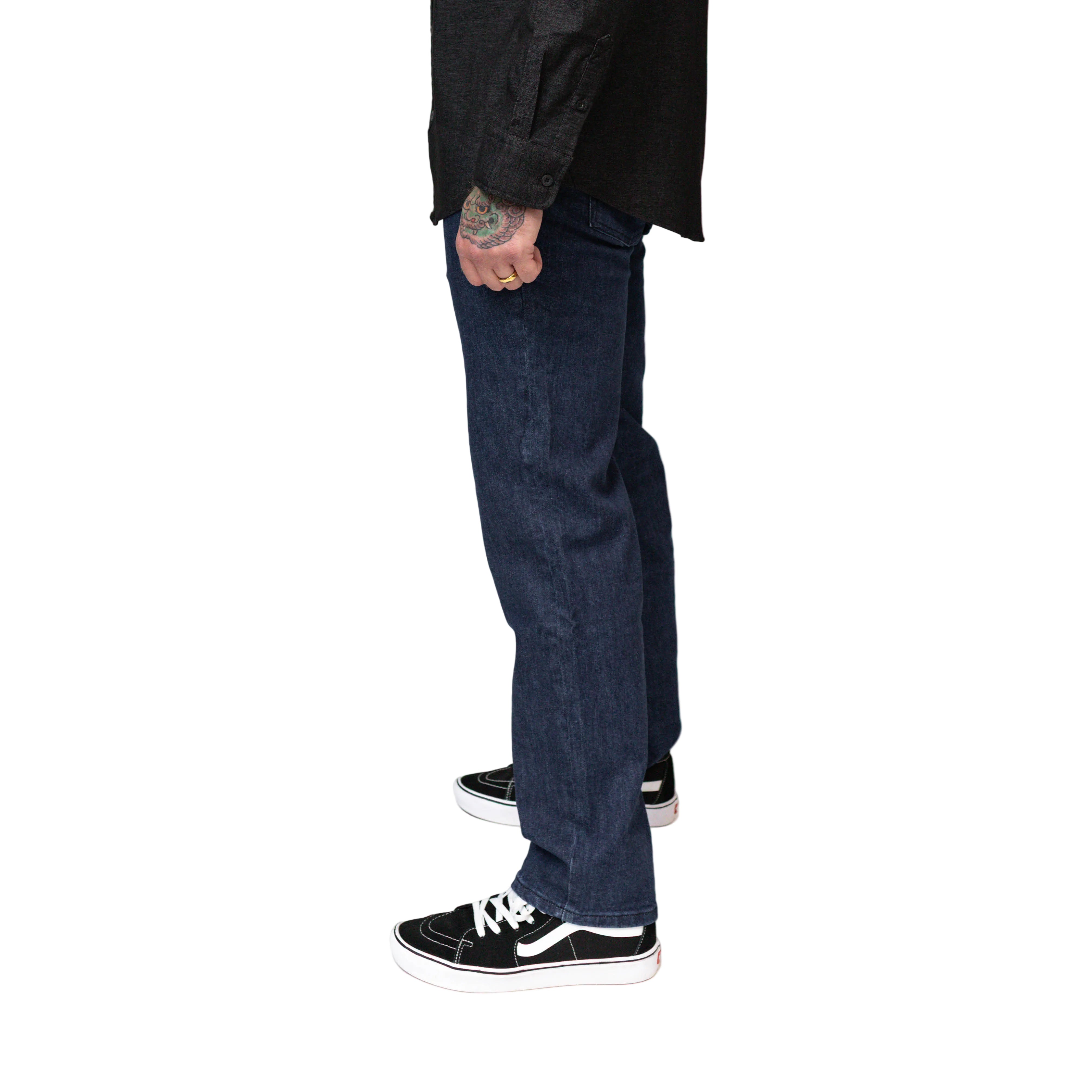 On body view of the TD McQuade Tactical Jeans in the Midnight wash showing the stretch tactical denim fit, concealed carry friendly waistband, discreet EDC pocket access, and reinforced construction for users searching for the best tactical jeans, CCW jeans, and everyday carry tactical denim.