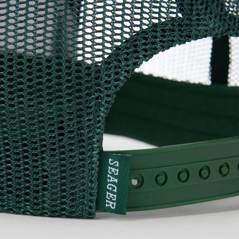 Close-up of a green mesh cap with a Seager logo on a white background