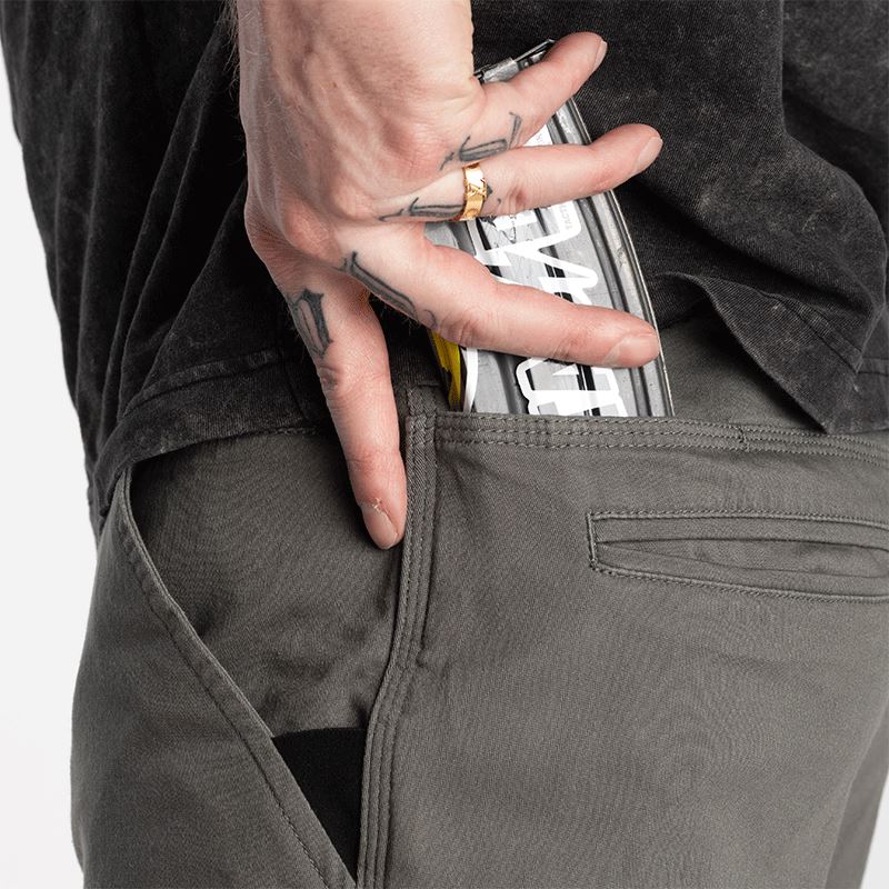 Photo showing the Carlos Ray Chino Tactical EDC Pants with a magazine securely stored in the concealed mag-ready back yoke pocket, demonstrating practical EDC functionality, discreet tactical storage, and low-profile chino styling for everyday carry