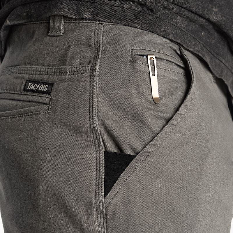 Close-up of the Carlos Ray Chino Tactical EDC Pants pocket setup highlighting reinforced front pocket edges for knife or clip carry, dual coin pockets, mag-ready back yoke pockets, and hidden handcuff key stash for discreet tactical EDC functionality in a low-profile chino design