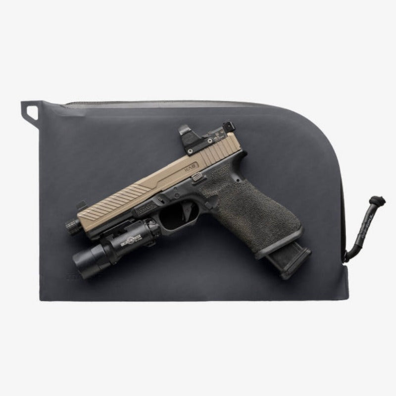 Magpul DAKA Single Pistol Case Black shown with full size handgun resting on top for size reference and compact soft case storage comparison