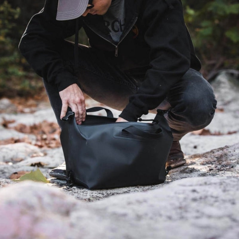 Magpul DAKA Takeout Large Bag shown in use | 8.88L waterproof tactical storage bag with reinforced seams and AquaGuard zipper — one of the best range bags for hauling tools, gear, and field essentials.