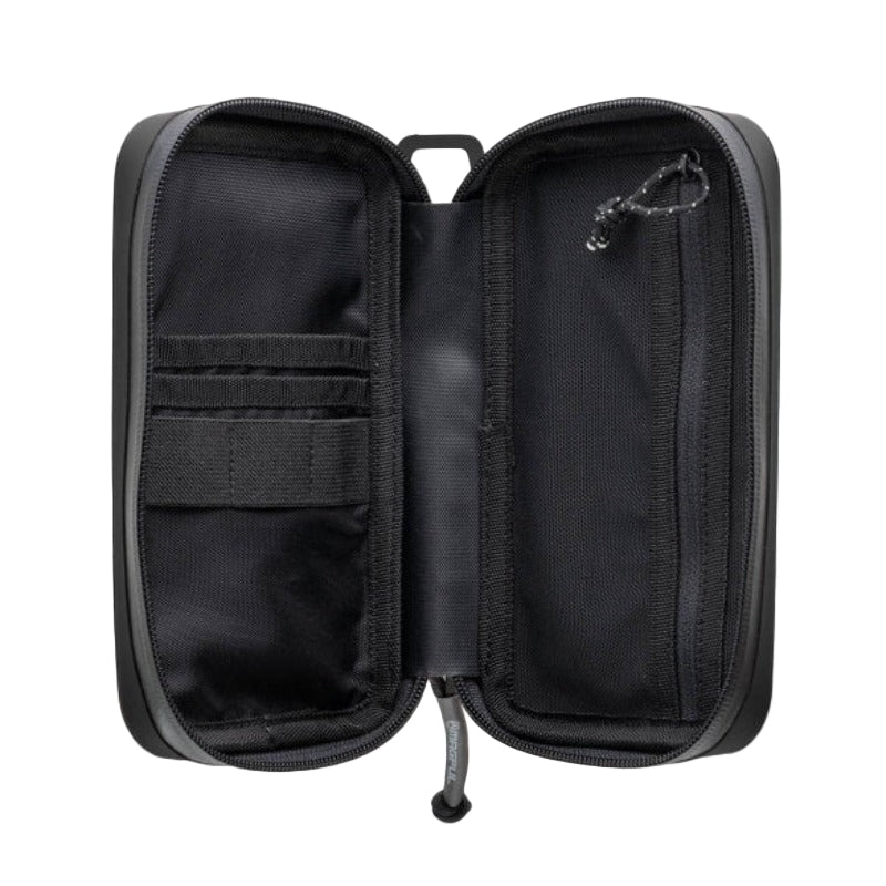 Magpul DAKA Utility Organizer in Black shown unzipped with interior organization visible, featuring zippered mesh pocket, vertical stash pockets, and elastic retention loops inside rugged polymer infused EDC admin pouch made in the USA