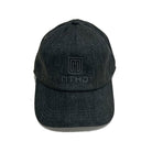 Free-standing baseball cap in black color with MTHD logo and brand name lettering in the center 