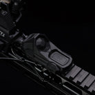 top view of Unity AXON SYNC switch showing angled light button and flat laser button configuration