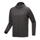 Arc'teryx Cormac Hoody in dark grey shown at an angle, highlighting the lightweight long-sleeve construction, low-profile hood, and Arc'teryx chest logo.