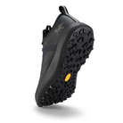 Black hiking shoe with a textured sole on a white background