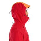 Front view of the Arc'teryx Alpine Guide Jacket in Dynasty II red with the hood up showing the professional ski guide StormHood design and GORE TEX PRO protection featured in the Arc'teryx on sale collection.