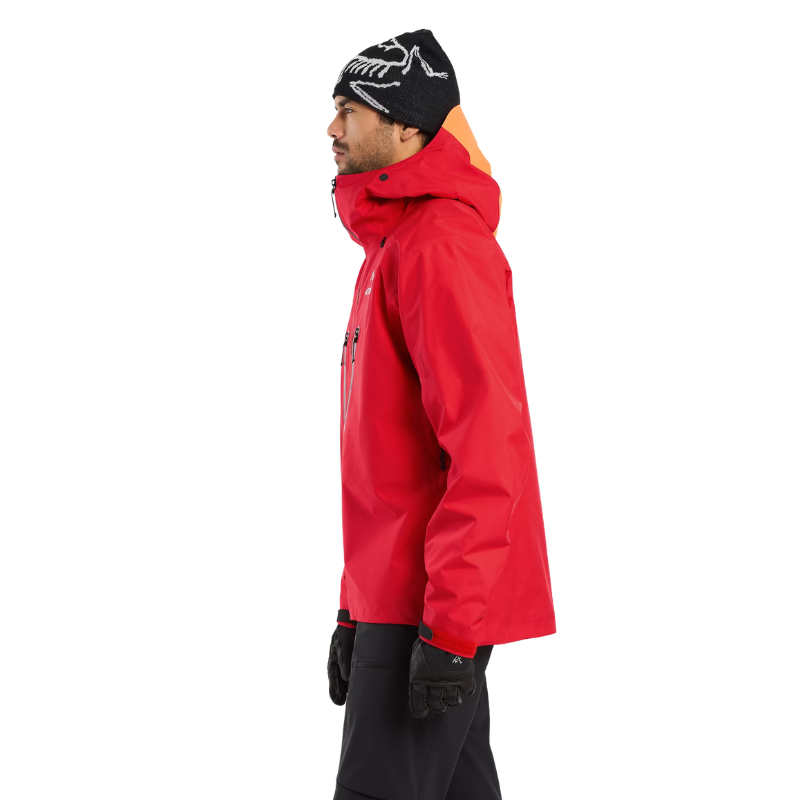 Side view product shot of the Arc'teryx Alpine Guide Jacket in Dynasty II red showing the professional ski guide GORE TEX PRO winter shell offered in the Arc'teryx on sale collection.