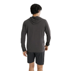 Arc'teryx Cormac Hoody in dark grey shown from the back on a male model, featuring a lightweight long-sleeve design and low-profile hood.