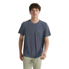 Arc'teryx Cormac Crew Neck Shirt in Dark Stratus grey worn on trail highlighting quick dry waffle knit fabric ideal for warm climate trekking and endurance outdoor performance