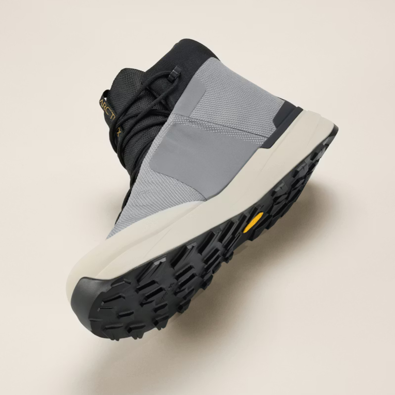 Gray and black boot on a beige background