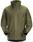 Product shot of the Arc'teryx LEAF Alpha Jacket Gen 2.2 in Ranger Green showing the military fit GORE TEX 3 layer waterproof tactical shell with StowHood, upper arm ID patches, and mission ready pocket layout designed for wet weather operations.