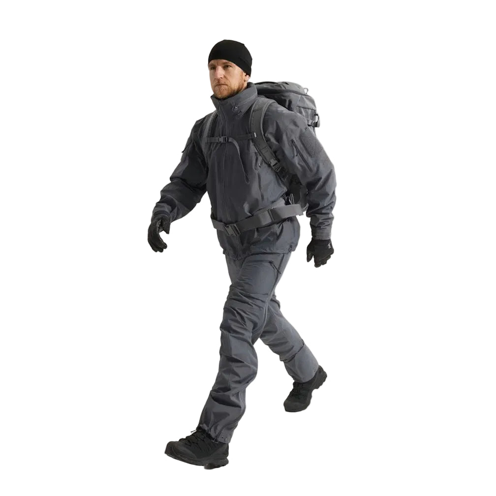 Full body view of the Arc'teryx LEAF Alpha Jacket Gen 2.2 in Wolf Grey being worn, showing the military fit, waterproof GORE TEX protection, and mission ready design suited for law enforcement, military, and tactical field use across the United States.