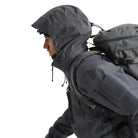 Close up view of the Arc'teryx LEAF Alpha Jacket Gen 2.2 in Wolf Grey with the hood in use, highlighting the StowHood design, weatherproof GORE TEX protection, and field ready construction for tactical operators and law enforcement across the United States.