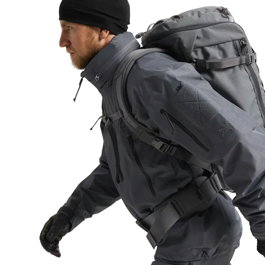 Close side view of the Arc'teryx LEAF Alpha Jacket Gen 2.2 in Wolf Grey highlighting the arm pocket, Velcro ID patch area, and rugged GORE TEX fabric designed for tactical durability and professional field use across the United States.