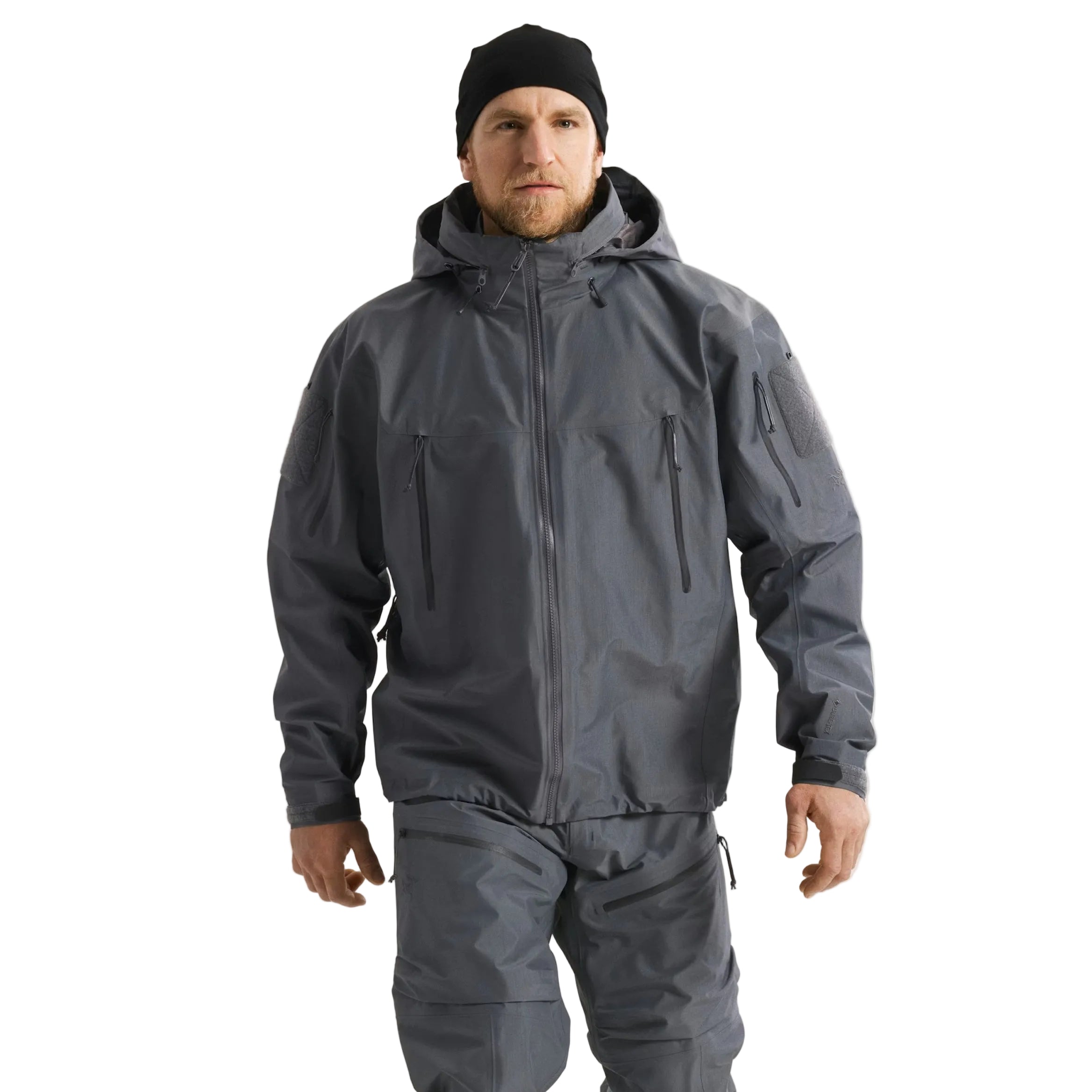 Front worn view of the Arc'teryx LEAF Alpha Jacket Gen 2.2 in Wolf Grey showing the military fit, stowable hood design, and waterproof GORE TEX construction as worn in the field by tactical operators and law enforcement professionals across the United States.