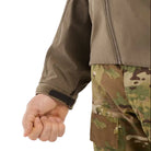 Close up detail of the wrist cuff on the Arc'teryx LEAF Practitioner AR Jacket in Crocodile showing the stretch knit cuff construction, durable Fortius Air 50 fabric, and low bulk insulation designed for secure layering, comfort, and unrestricted movement during tactical operations and outdoor missions.