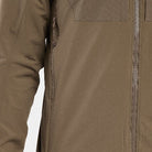 Close up detail of the Arc'teryx LEAF Practitioner AR Jacket in Crocodile showing the No Slip Zip front zipper, TPU zipper pulls, and breathable side vent construction designed for heat management, mobility, and high performance tactical layering in dynamic conditions.