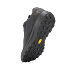 Angled bottom view of the Arc'teryx Norvan LD 4 GTX in Black/Black showcasing the Vibram Megagrip outsole with aggressive 4mm trail lugs.