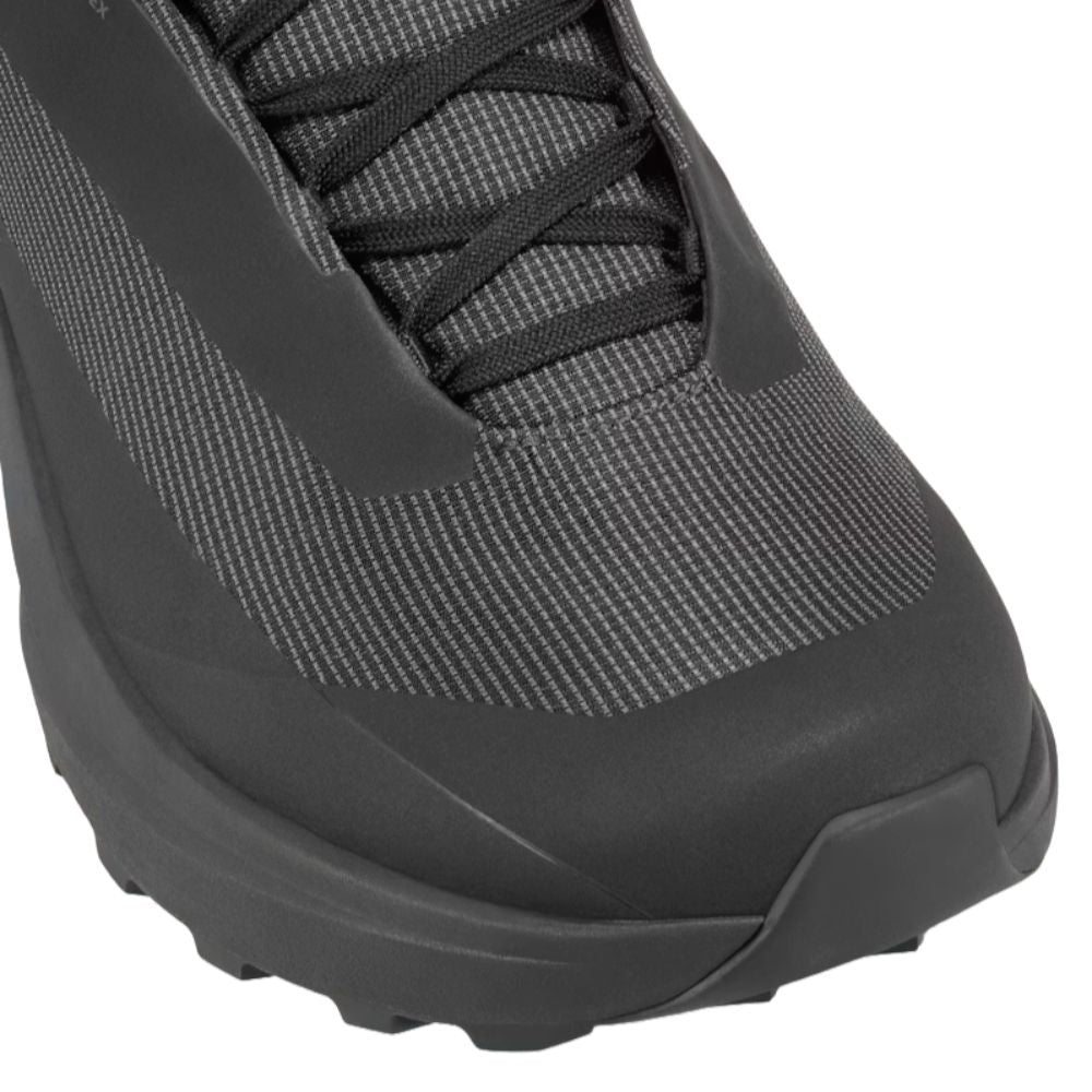 Close-up of the Arc'teryx Norvan LD 4 GTX in Black/Black showing the smooth-pull lacing system, reinforced toe area, and waterproof upper.