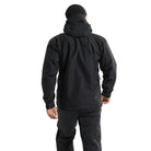 Back worn view of the Arc'teryx PRO Alpha LT Jacket Gen 2.2 in Black showing the military fit patterning, streamlined hood construction, and lightweight GORE TEX 3 layer shell designed for high mobility tactical movement. This PRO-series jacket originates from the Arc'teryx LEAF lineage and is built for wet weather field operations.