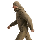 Full body side view of the Arc'teryx PRO Alpha LT Jacket Gen 2.2 in Crocodile showing the Arc'teryx logo on the upper arm along with the streamlined military fit and lightweight GORE TEX 3 layer construction. This PRO-series shell, evolved from the former Arc'teryx LEAF line, is designed for high mobility tactical movement and wet weather field operations.