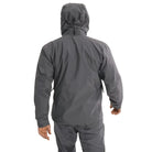 Back worn view of the Arc'teryx PRO Alpha LT Jacket Gen 2.2 in Wolf Grey showing the articulated military fit, streamlined hood profile, and lightweight GORE TEX 3 layer shell construction. This PRO-series jacket, evolved from the Arc'teryx LEAF program, demonstrates full weather protection and mobility for tactical field operations.