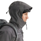 Hood-up view of the Arc'teryx PRO Alpha LT Jacket Gen 2.2 in Wolf Grey, showing the fixed hood design, streamlined PRO-series fit, and lightweight GORE TEX 3 layer construction. This tactical shell, evolved from the Arc'teryx LEAF program, provides full weather protection and mobility in wet field conditions.