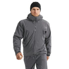 Front worn view of the Arc'teryx PRO Alpha LT Jacket Gen 2.2 in Wolf Grey showing the streamlined military fit, lightweight GORE TEX 3 layer weatherproof construction, and low profile PRO-series design evolved from the former Arc'teryx LEAF line. Built for high mobility and wet weather tactical operations.