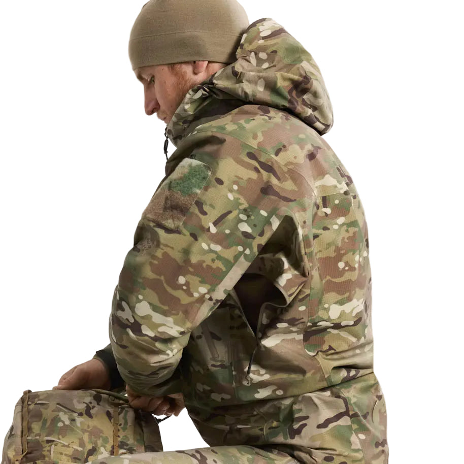 Side profile of Arc'teryx PRO Alpha LT Gen 2.1 Multicam highlighting articulated elbows and military fit built for unrestricted movement in harsh weather