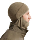 Side view of the Arc'teryx PRO Assault Balaclava FR Gen 2 in Crocodile worn with the fabric positioned under the chin, showing the flame resistant Defender M mesh knit, ergonomic shaping, and low-profile fit optimized for helmet compatibility and comms gear. Highlights breathable FR protection for direct action and high-mobility tactical environments.