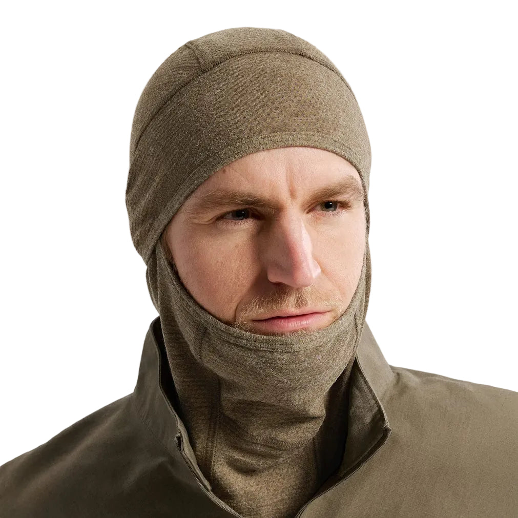 Front view of the Arc'teryx PRO Assault Balaclava FR Gen 2 in Crocodile being worn, showing the flame resistant Defender M mesh, full facial coverage, and breathable design engineered for PPE integration with helmets, comms, and eye protection. Built for direct action missions requiring FR protection, airflow, and low-profile tactical performance.