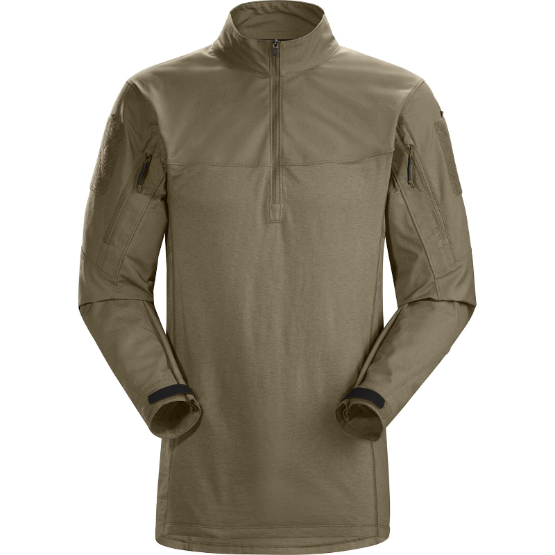 Front view of the Arc’teryx PRO Assault Combat Shirt in Crocodile. No melt/no drip combat shirt engineered for direct action, built with NYCO Cordura® ripstop and Cyberknit jersey. Features a low-profile zip neck, articulated cut, and body armor compatibility for tactical performance.