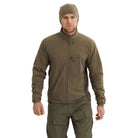 Arc'teryx PRO Atom LT Jacket Gen 2.1 in Ranger Green worn from the front during range movement, streamlined military insulation jacket designed for armor compatible performance and breathable warmth