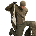 Arc'teryx PRO Atom LT Gen 2.1 Ranger Green worn beneath waterproof shell, breathable tactical insulation layer optimized for wet weather operations and extended cold climate deployment