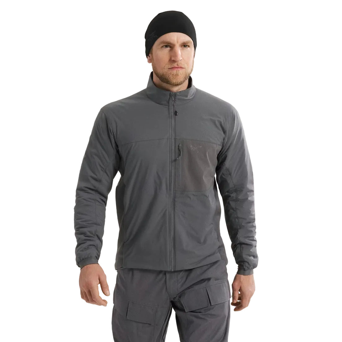 Arc'teryx PRO Atom LT Jacket Gen 2.1 in Wolf Grey worn from the front during cold weather movement, streamlined tactical insulation jacket compatible with armor systems and professional operational loadouts