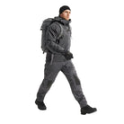 Full body view of Arc'teryx PRO Atom LT Jacket Gen 2.1 in Wolf Grey being put on, lightweight tactical outer layer built for cold weather training, law enforcement duty, and mission adaptable gear systems
