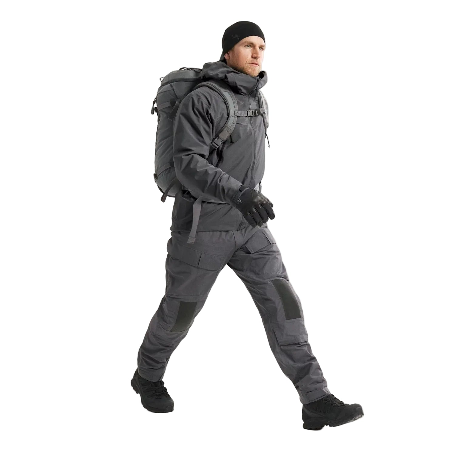 Full body view of Arc'teryx PRO Atom LT Jacket Gen 2.1 in Wolf Grey being put on, lightweight tactical outer layer built for cold weather training, law enforcement duty, and mission adaptable gear systems
