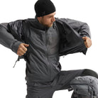 Arc'teryx PRO Atom LT Gen 2.1 Wolf Grey worn under waterproof shell jacket, high performance insulated mid layer designed for multi climate deployment and wet weather tactical operations