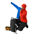 Image showing the Arc'teryx PRO Practitioner AR Hoody in Dynasty worn as a midlayer beneath an outer shell, highlighting the breathable Fortius Air 50 fabric, Octa Loft insulation, and mobility focused design built for tactical operations and outdoor missions across varied U.S. climates.