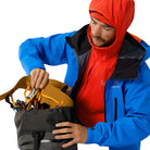 Image showing the Arc'teryx PRO Practitioner AR Hoody in Dynasty worn as a technical midlayer, highlighting its Octa Loft insulation, breathable Fortius Air 50 fabric, and streamlined fit designed for tactical field operations and backcountry performance across U.S. climates.