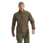 Front view of the Arc'teryx PRO Practitioner AR Jacket in Ranger Green being worn, showing the dual chest pockets, articulated fit, and Fortius Air 50 breathable shell. Highlights the Octa Loft insulation and low-profile tactical design that makes this PRO-series mid layer ideal for military and law enforcement use, cold-weather layering systems, and high-output field movement.